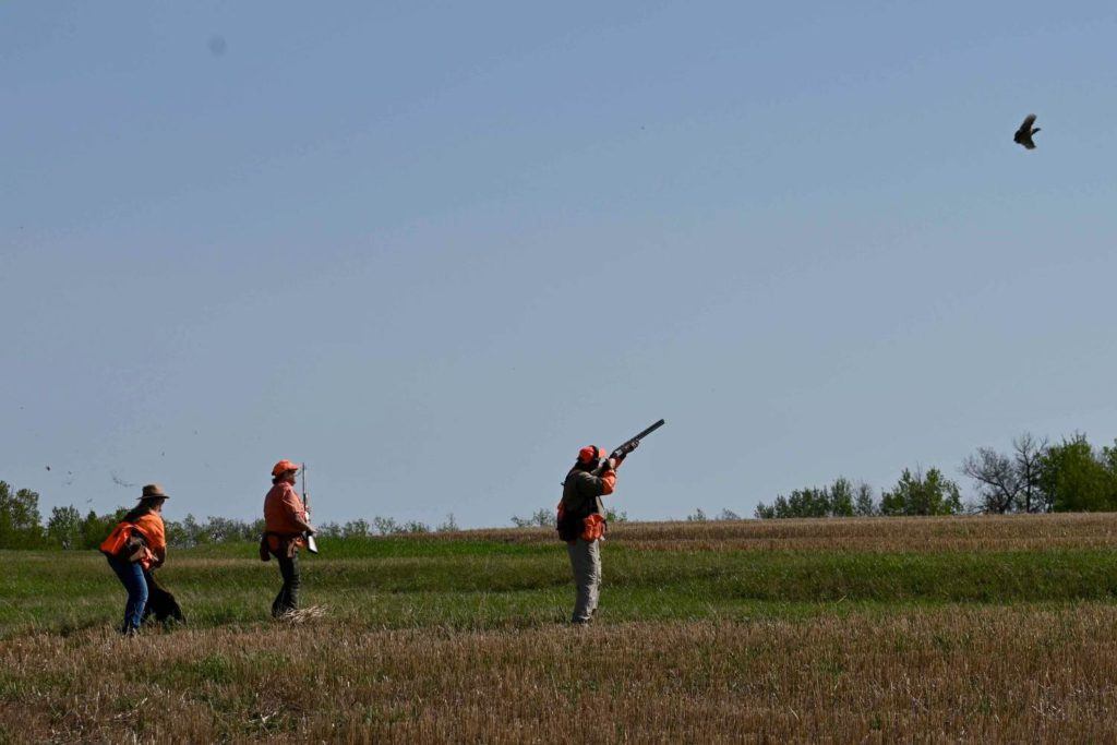 Man shooting a bird